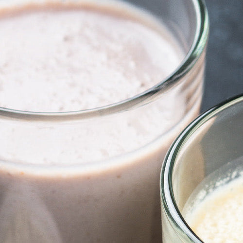 3 different flavored protein shakes in glasses.